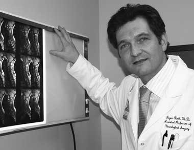 PRAISE FOR A DETERMINED PATIENT: Neurosurgeon Dr. Roger Hartl says Firefighter Eugene Stolowski's mental toughness played a large role in his ability to survive a serious spinal injury that had left him near death. (03.04.05)