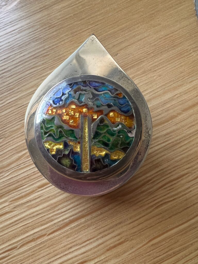 Teardrop shaped silver box with enamel of World Trade Center, made on 9/11/01 by Michael & Maureen Banner.