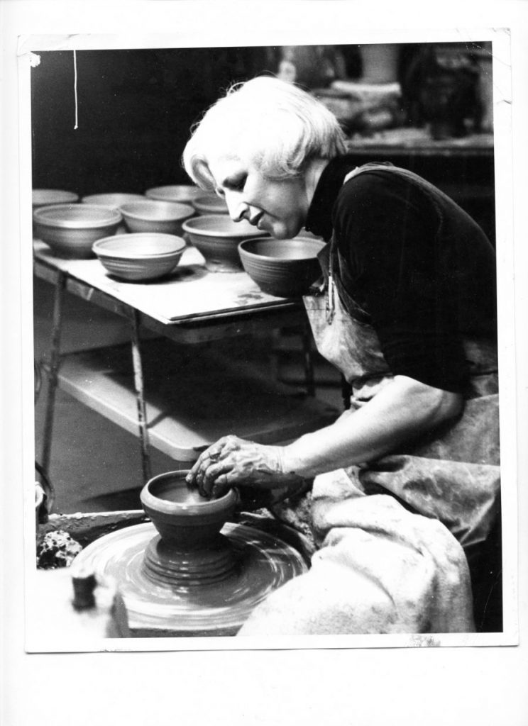 Potter Edna Arnow demonstrating at the wheel. 1968.