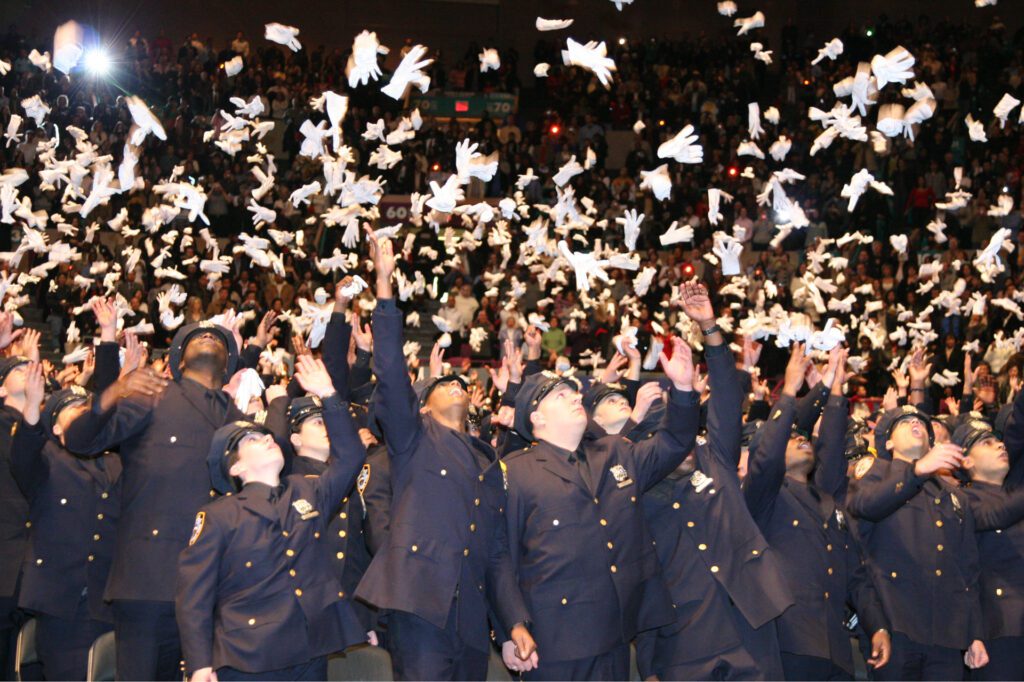New York City’s Police Academy graduates celebrate by throwing their gloves in the air. Family and friends of the 1,359 rookies fill Madison Square Garden in the December 2006 ceremony. I was especially proud of this shot because I was using an early digital camera with a lag time between pressing the shutter and the picture being recorded. The reporter from The Chief, Reuven Blau, alerted me that the gloves were about to fly.